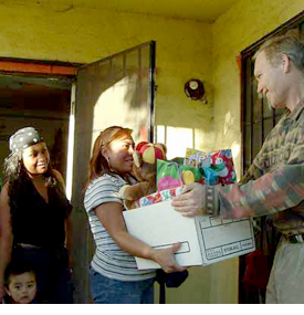 Happy family accepts Christmas gifts when struggling financially.