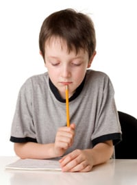 Young boy writing a letter to Santa